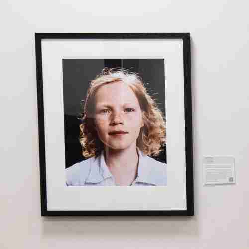 Photographic artwork of a young girl hanging on the wall