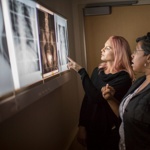 women looking at x-ray