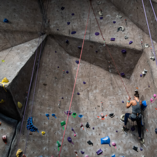 A person uses the climbing wall on Grand Valley's Allendale Campus.