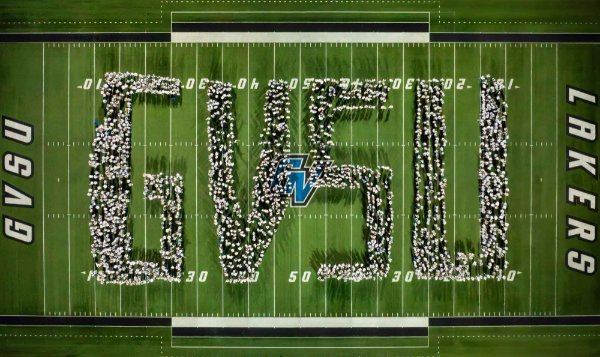 A drone photo of students making the letters GVSU on a football field. 