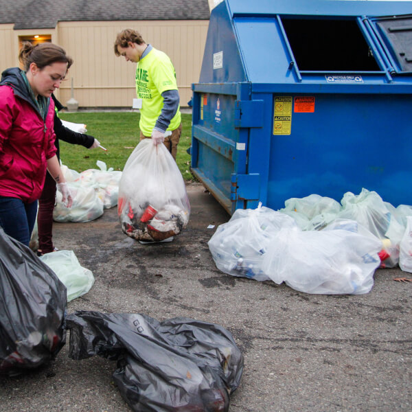 Grand Valley staff collect trash for recycling.