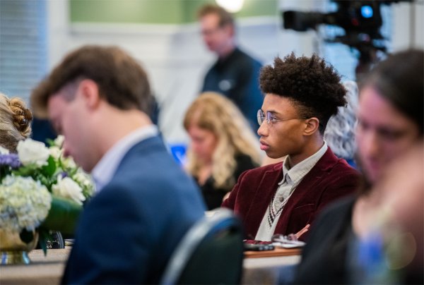 A GVSU student listens to Bror Saxberg speak at the President's Forum on October 25.