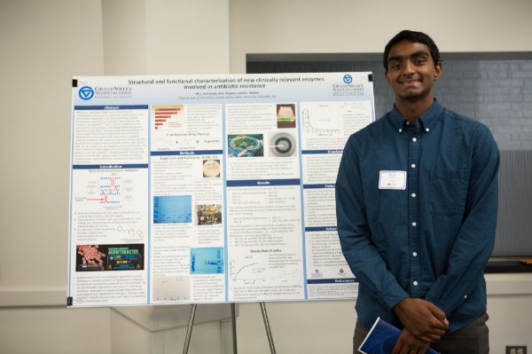 Micah Fernando pictured in front of his research poster