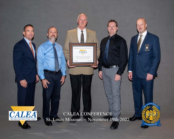 GVPD and CALEA officials pose with a law enforcement certificate