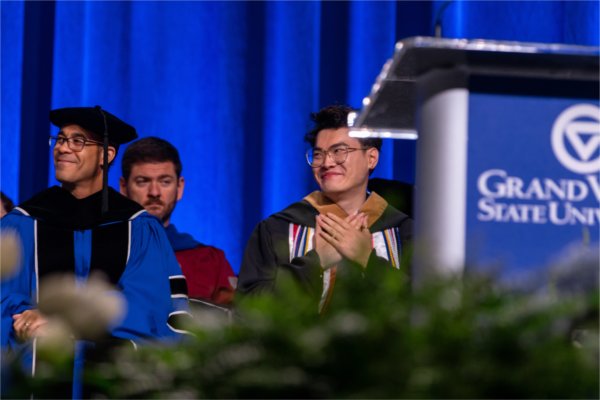 Jowei Yek, student speaker at Saturday morning's ceremony, smiles with gratitude as he is announced.