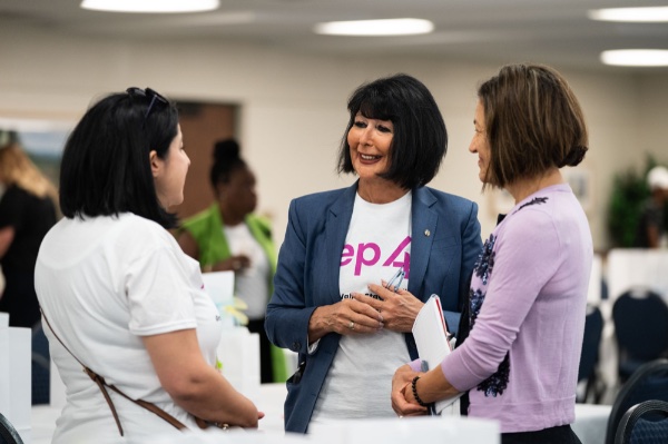 President Philomena Mantella speaks with two participants in the REP4 summit.
