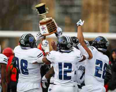 Grand Valley players hold up the Anchor-Bone Classic trophy after beating Ferris State last season.
