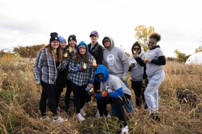 nine student posing outdoors at the SAP during Make a Difference Day