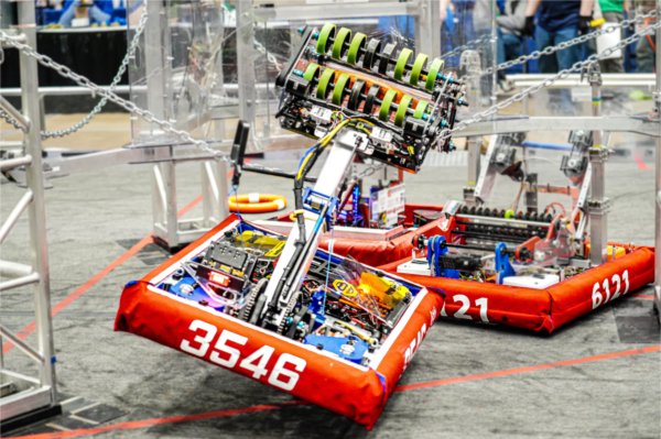 two robots with cranes attached compete against each other