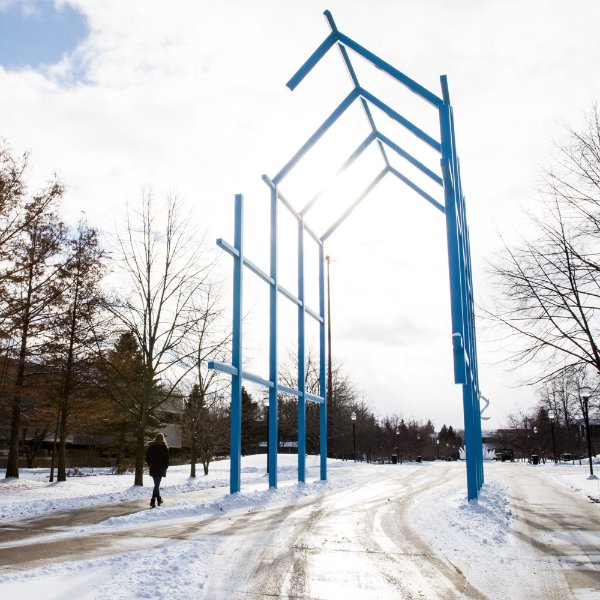 winter photo of Transformational Link sculpture on campus