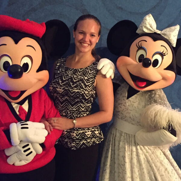 GVSU alumna Elizabeth Stolz pictured with Mickey and Minnie Mouse.
