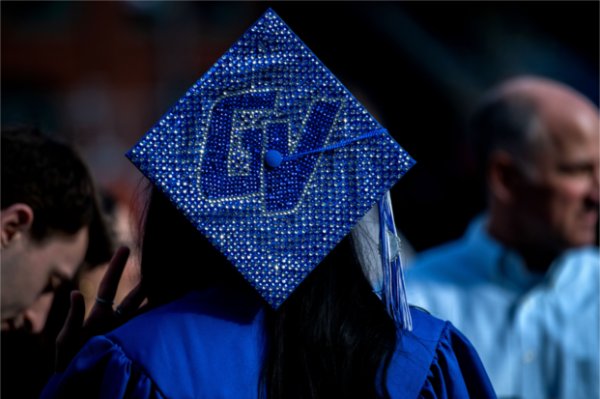A bedazzled cap with the letters GV adorn the mortarboard.  