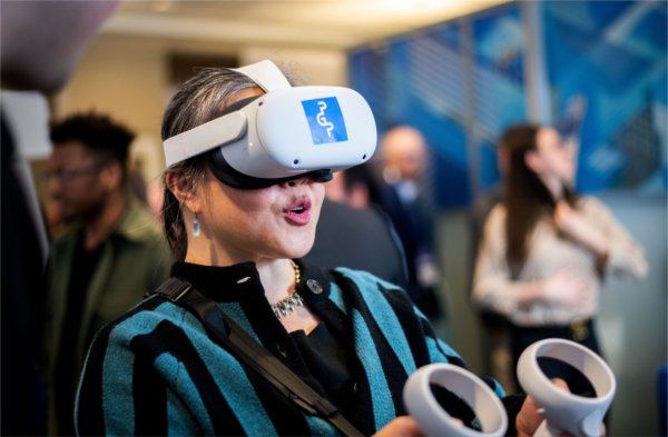  A person uses a virtual reality headset. 