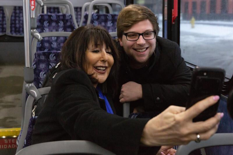President-elect Mantella pictured taking a selfie with a student while riding The Rapid campus connector.