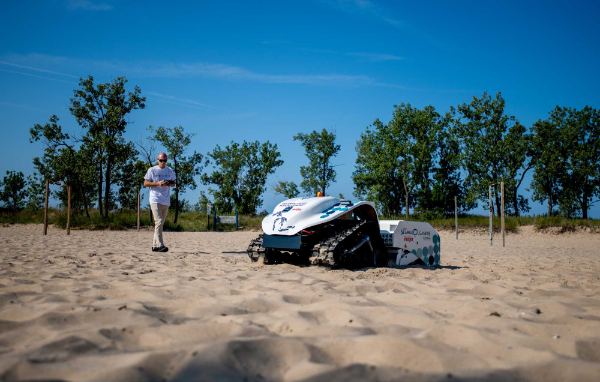 A drone combs a beach for plastic and litter.