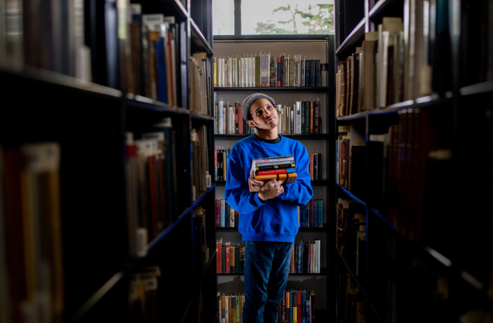 Student scholar student in library.