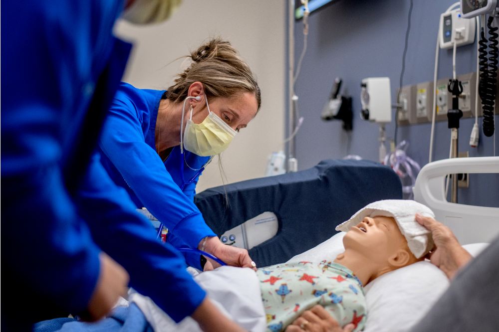 Student doing pediatric nurse simulation