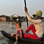 woman with child in boat
