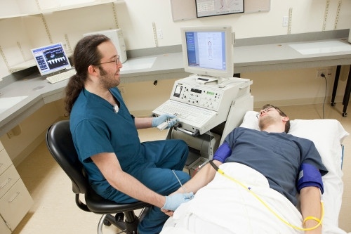 Student performing ultrasound