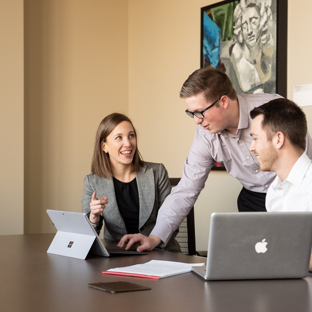 people working at a desk together