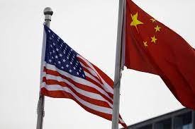 The U.S. and Chinese Flag Both wave Downtown GR