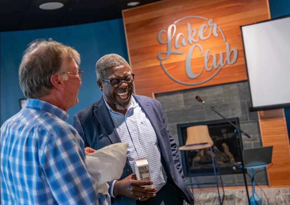 GVSU dean and faculty member sharing a snack and a laugh at the GVSU faculty lounge