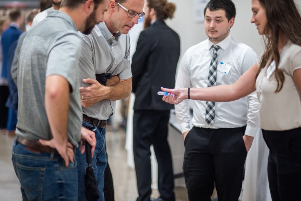 Student showing off project