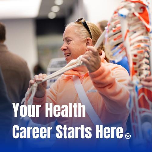 Person in orange sweatshirt holding skeleton arm. Text reads: your health career starts here.