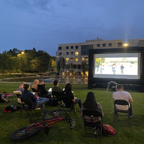 People watching an outdoor movie