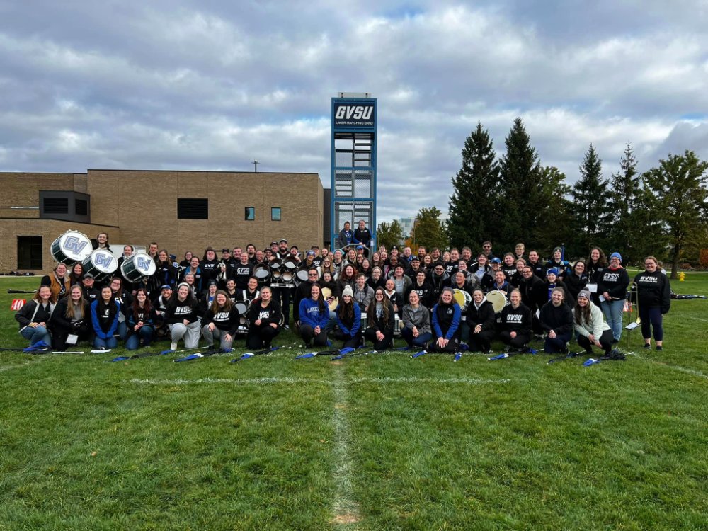 Laker Marching Band Alumni pose for a photo during Homecoming 2023