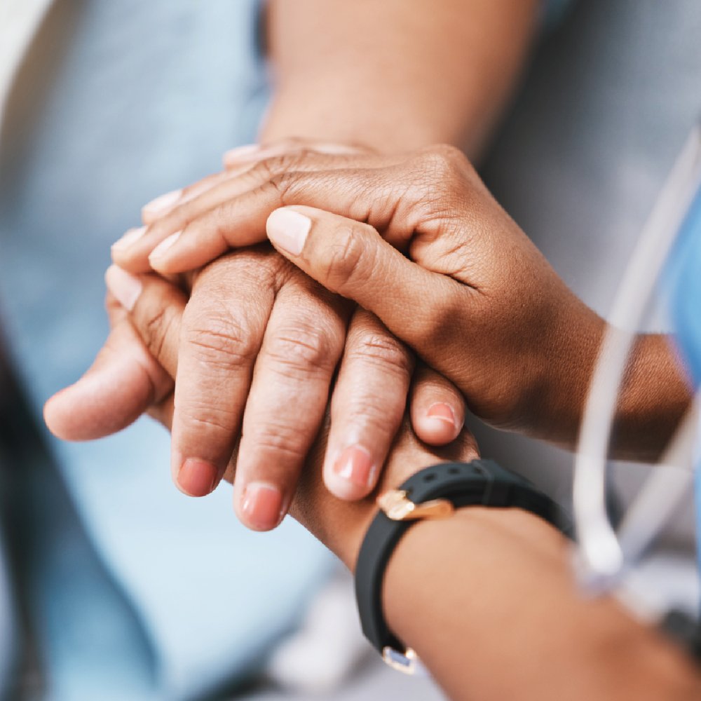 A person holding another person's hand