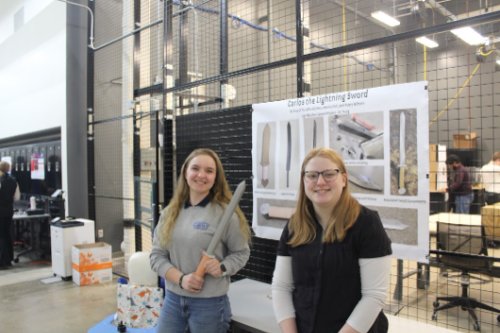 Two Engineering students present their shortsword they created for a class.