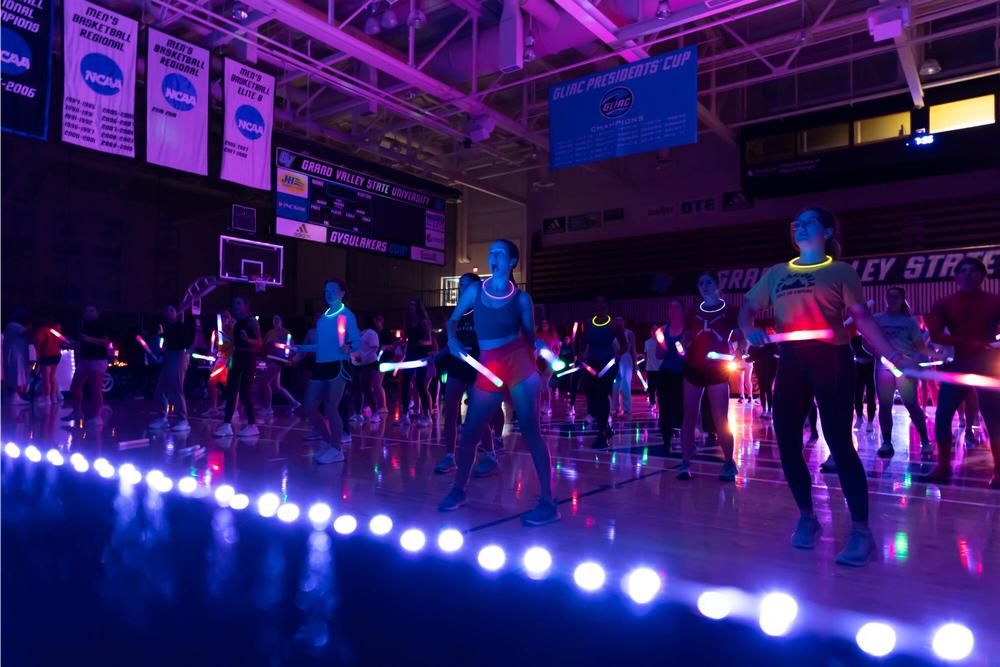 Monster Mash dance event in arena with glow lights