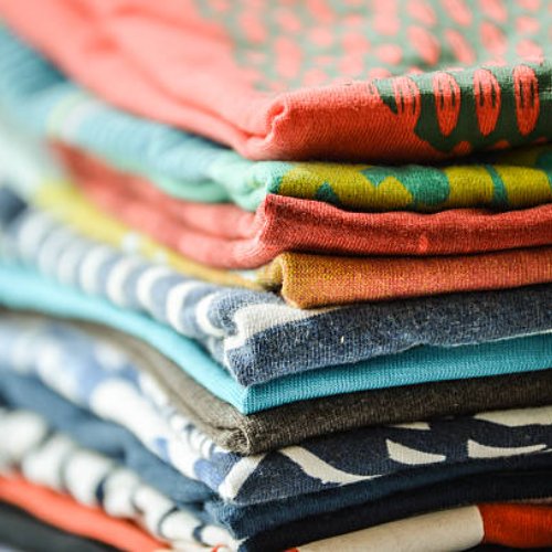 Pile of folded t-shirts