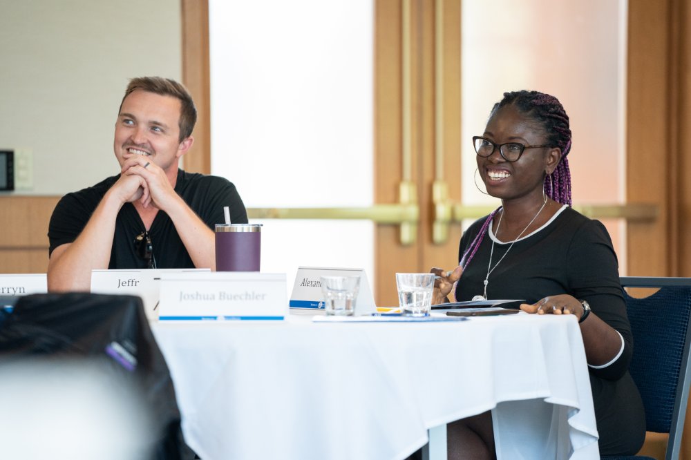 two students sitting at a table together