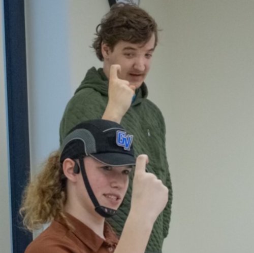 Mae and Austin practicing ASL