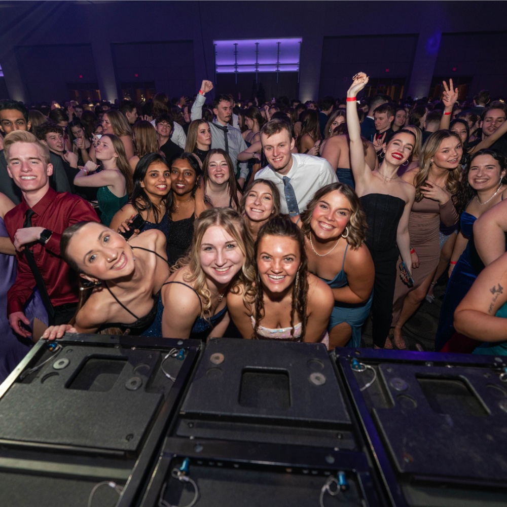 group of students posing and dancing at 2024 Presidents' Ball