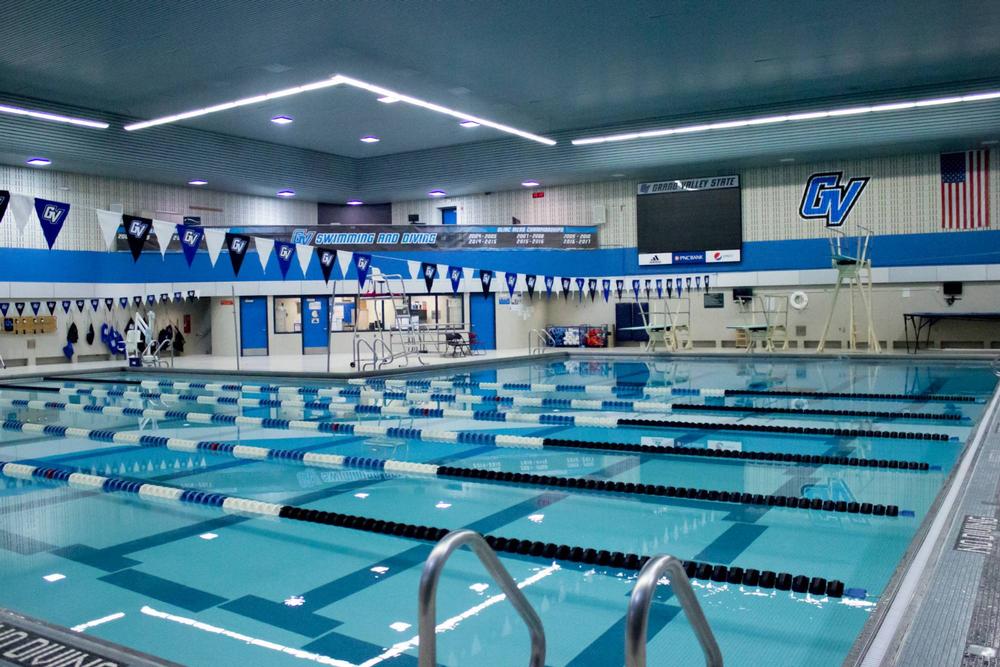 The GVSU Pool, reflecting a light blue color and striped by lane buoys.