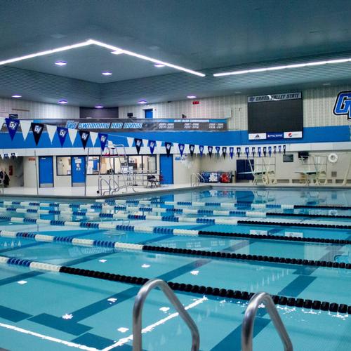 The GVSU Pool, reflecting a light blue color and striped by lane buoys.