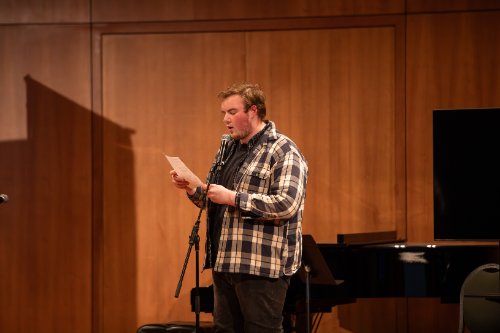 A student reading a poem