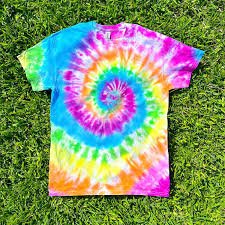 Tie dye t shirt lying in grass