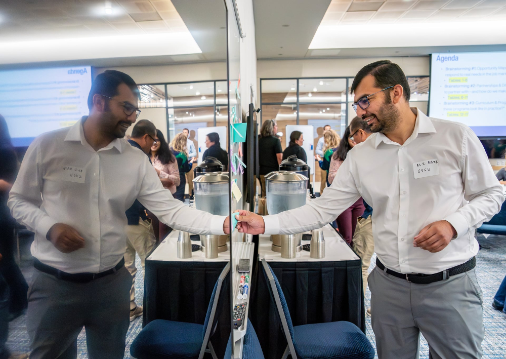 Ali Raza, assistant professor of computing, participates in a College of Computing brainstorming session.