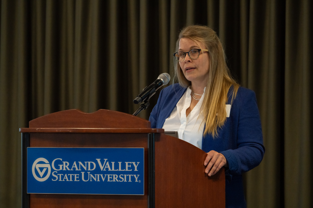 Daisy Fredericks, associate professor and director of teacher education, gives remarks.