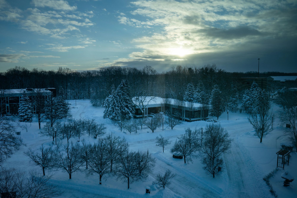 two lake buildings on the Allendale Campus pictured, snowy sidewalks, bare trees