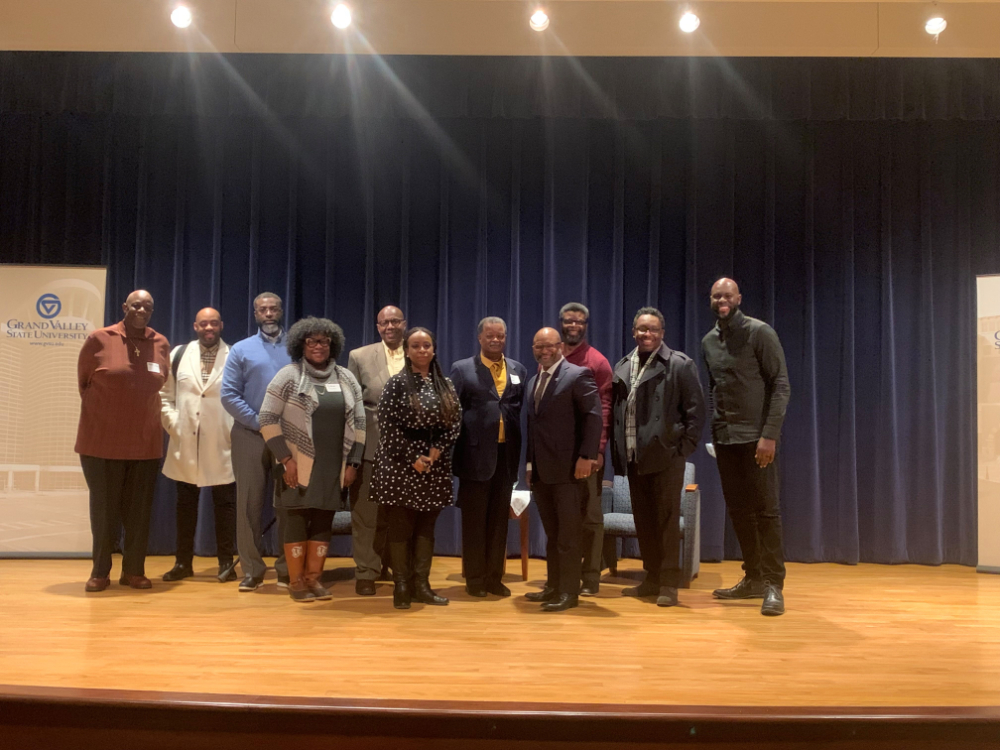two rows of people standing on a stage