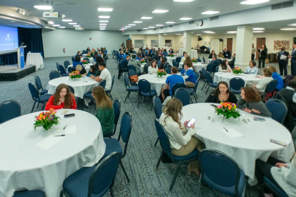 tables full of students and others in the Grand River Room of the Kirkhof Center