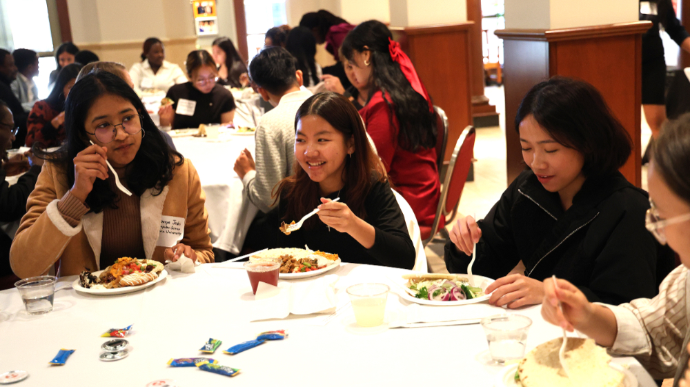 students eating at round table in DeVos Center