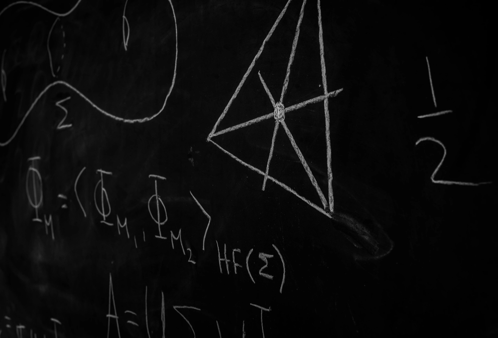a mathematics equation on a chalkboard