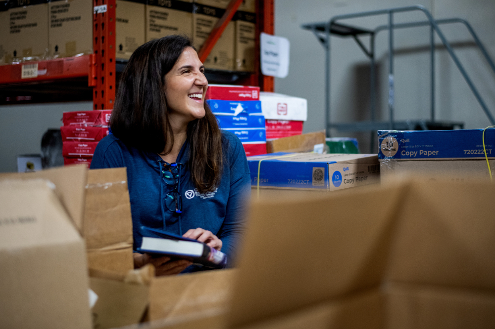 Megan Freudigmann is pictured in a book warehouse