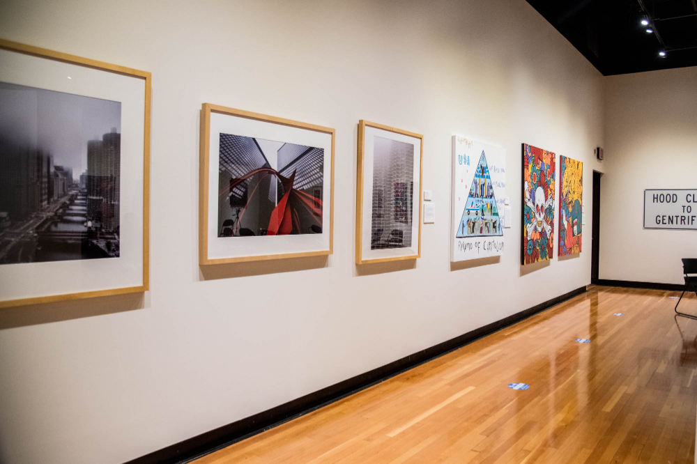 a wall filled with various artwork